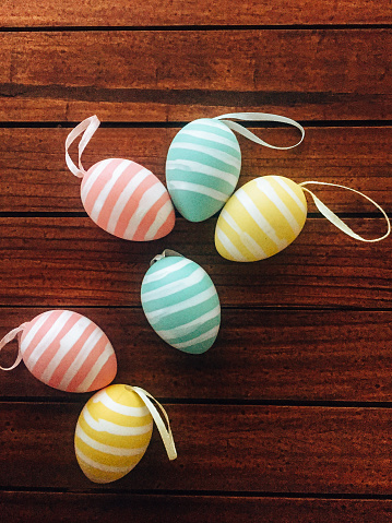Easter eggs on a bright  background. Easter celebration concept. Colorful easter handmade decorated Easter eggs. Place for text. Copy space.