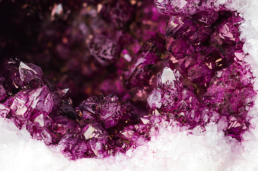 pink, purple, violet, macro detail texture background. close-up raw rough unpolished semi-precious gemstone.