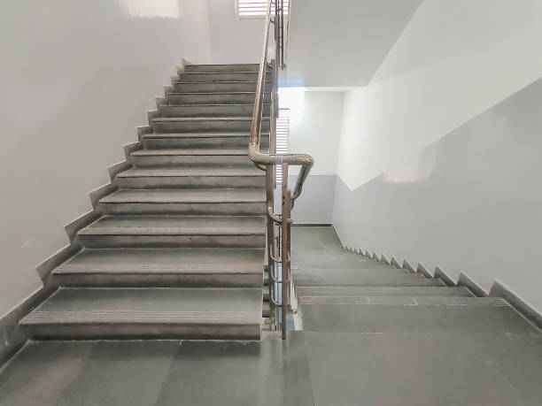 istock Staircase with hand railing for a commercial building. Fire escape staircase. Used selective focus 1453820020