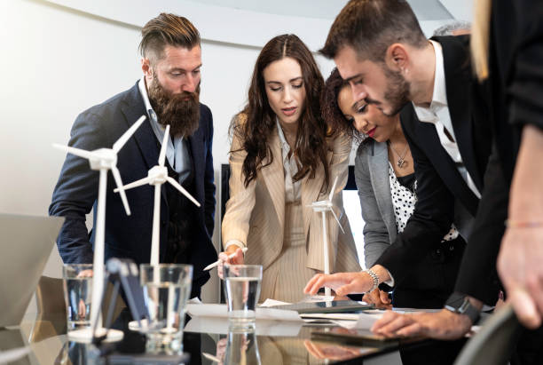 istock Multiethnic and multicultural business people working together on sustainable innovation project - Green renewable energy concept 1453820246