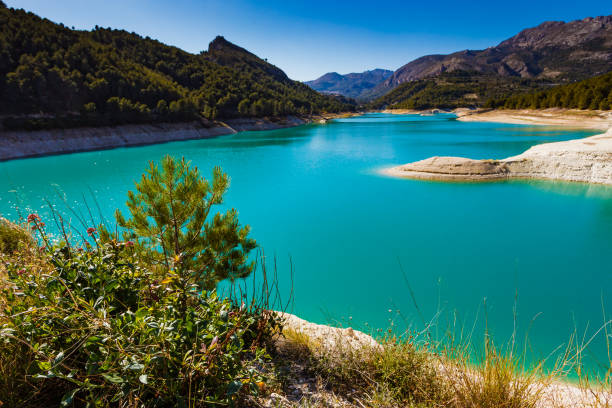 Guadalest Reservoir in Spain View on Guadalest water reservoir with turquoise water in Alicante province Spain reservoir stock pictures, royalty-free photos & images