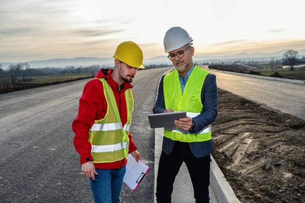 istock Engineer and investor on a road construction site 1453821414