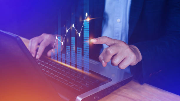 istock Businessman finger touch symbol stock graph and chart background, concept growth and development business investment, Stock market and strategy making market plan and stock market fluctuations 1453821517