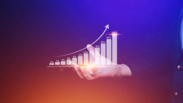 istock Businessman showing business growth on graph Hands touching graphs representing increasing profits, financial symbols coming 1453821557