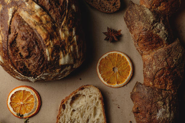 istock Baguette and different types of sourdough kraft bread on kraft paper background 1453821900