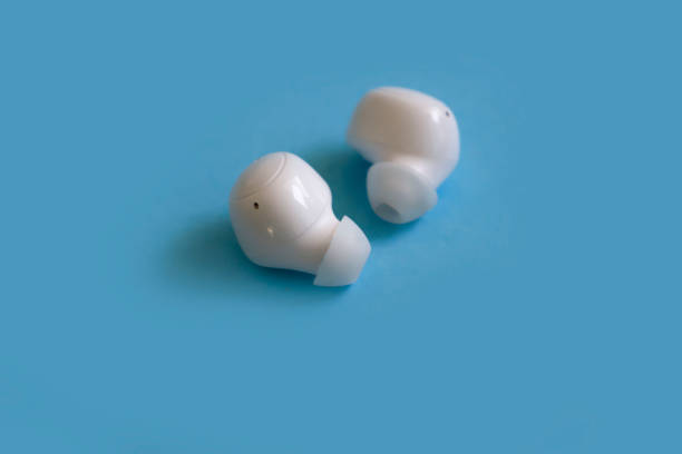 istock Wireless headphones on a colored background 1453824848