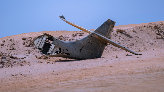 The tail of an airplane wreck abandoned on the beach in the north of Saudi Arabia in the gulf of Aqaba