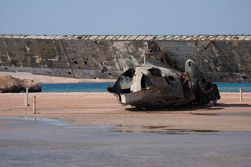 the wreck of an old airplane abandoned on the beach in the north of Saudi Arabia