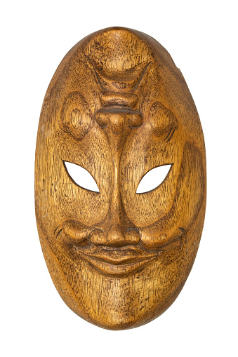 Wooden African mask isolated on white background. Travel souvenir.