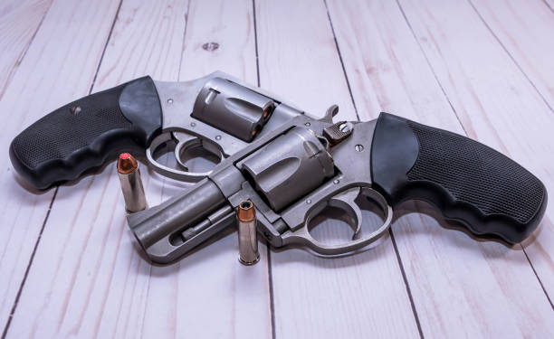 istock A 357 magnum and a 4 special revolver with a bullet for each next to them 1453827145