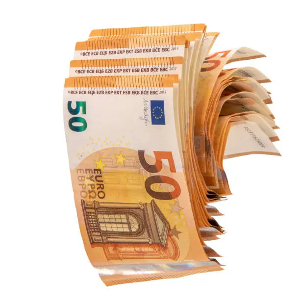 Photo of Several fifty euro banknotes unrolling