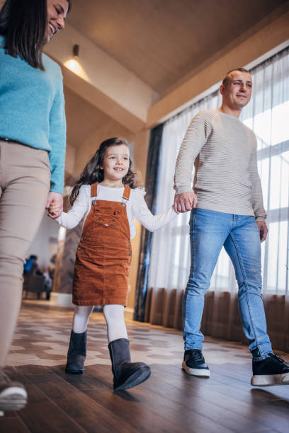 istock Family walking in hotel lobby 1453830082