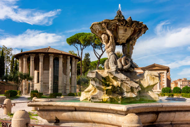 Fountain of Tritons and Temple of Hercules Victor in Rome, Italy Rome, Italy - October 2022: Fountain of Tritons and Temple of Hercules Victor in Rome triton greek god stock pictures, royalty-free photos & images