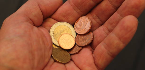 istock a handful of small money 1453834298