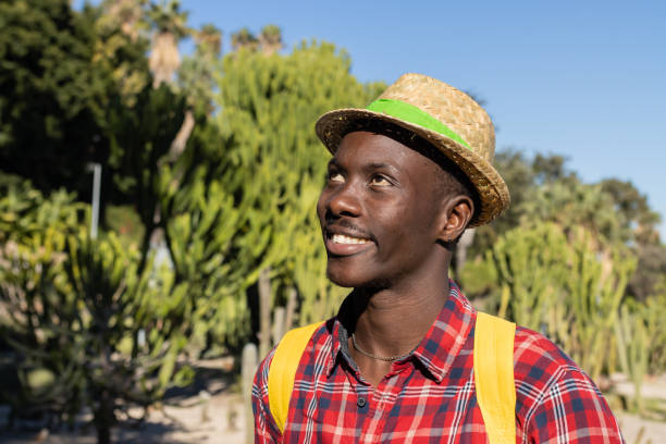 istock Smiling man in a botanical garden. 1453835341