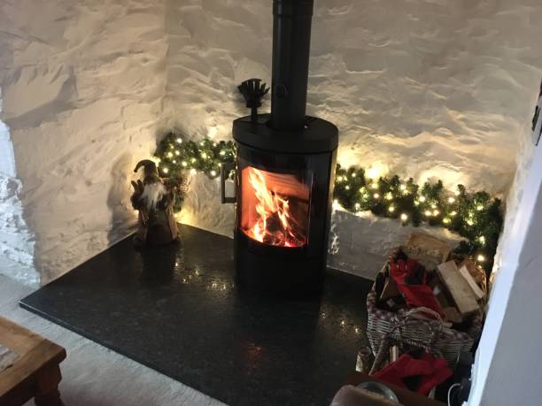 istock Festive country inglenook fireplace with log burner 1453835974