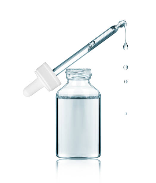 istock Cosmetic pipette with dripping drops close-up isolated on a white background 1453837237
