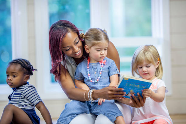 istock Reading with Daycare Children 1453837296