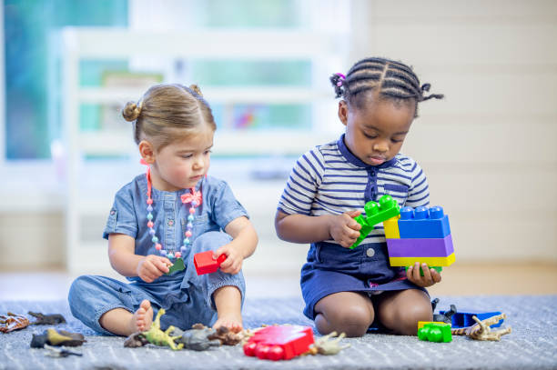 istock Toddlers Playing with Toys 1453837301