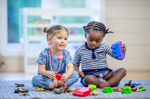 istock Toddlers Playing with Toys 1453837303
