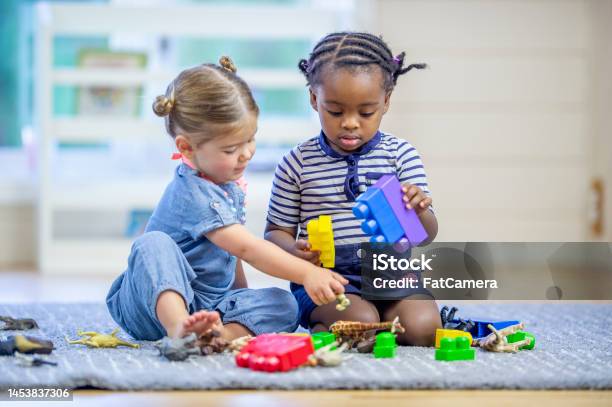 Toddlers Playing With Toys Stock Photo - Download Image Now - Child Care, Baby - Human Age, Playful