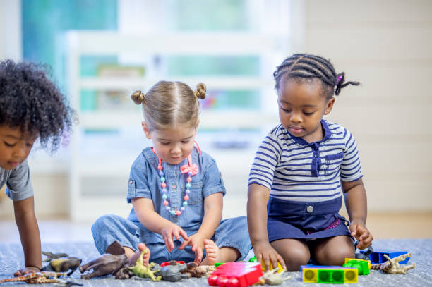istock Toddlers Playing with Toys 1453837307