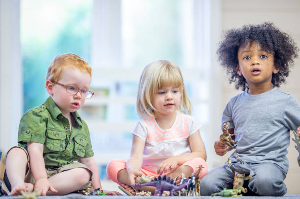 istock Toddlers Playing with Toys 1453837312