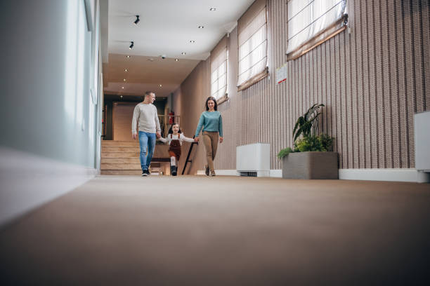 istock Family walking in hotel corridor 1453837873