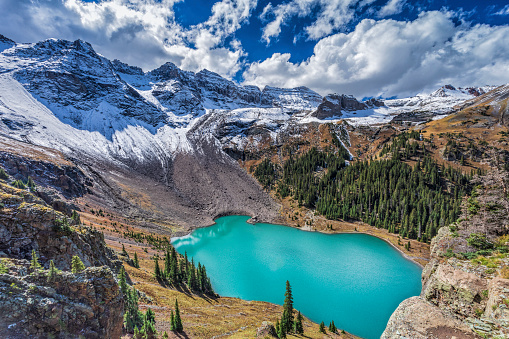 An epic view from a ledge high above Lower Blue Lake in the Mount Sneffels Wilderness near Telluride, Colorado.