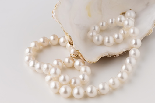 As classic as ever, the single strand of pearls with matching earrings.  Earrings have a tiny diamond for an added touch. Earrings have stud backs.
