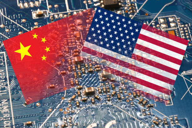 Flag of the Republic of China and the United States on microchips of a printed electronic board. Concept for world supremacy in microchip and semiconductor manufacturing. stock photo