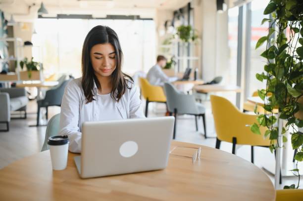 istock Hipster Girl use Laptop huge Loft Studio.Student Researching Process Work.Young Business Woman Working Creative Startup modern Office.Analyze market stock,new strategy 1453840555