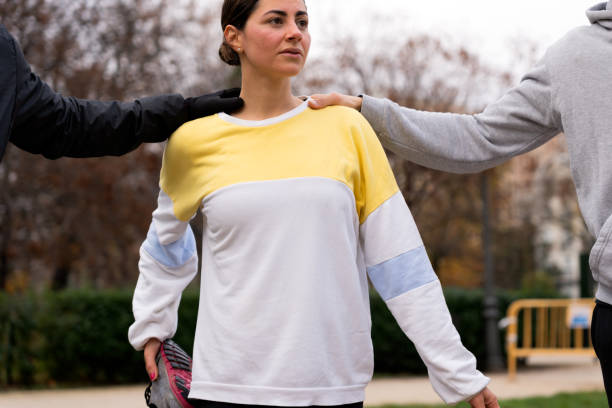 istock Athletes stretching in autumn park 1453842166