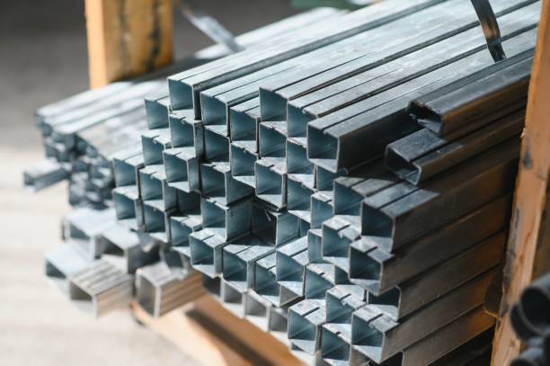 istock Stack of rolled metal products, perspective view of steel pipes of rectangular cross-section 1453842316