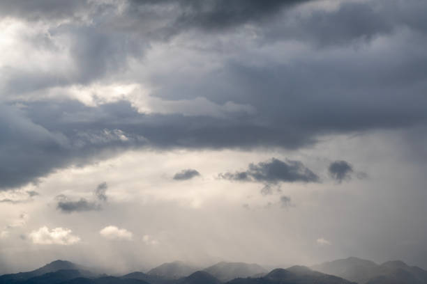 istock Dramatic sky, sunlight and cityscape in cloudy weather 1453843631