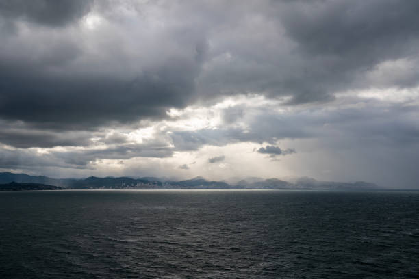 Dramatic sky, sunlight and cityscape in cloudy weather