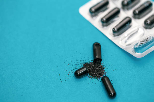 istock Pills on a blue background, close-up, medicine concept. 1453843766
