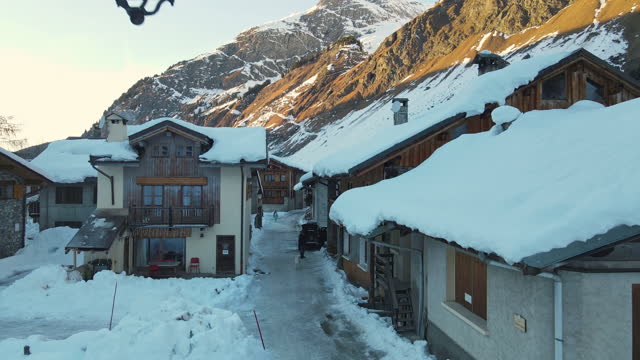 Old Swiss chalets and cottages covered with snow in winter time, small tourists village of Swiss Alps with its special mountains features, Alpine picturesque famous places, Swiss ski resort concept