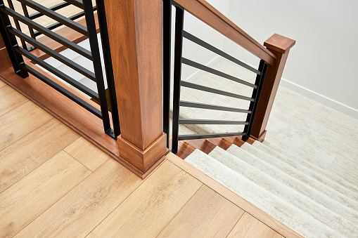 Wooden stairs and metal handrails