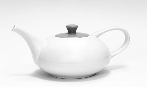 istock White teapot close-up on a white background isolated. 1453848452