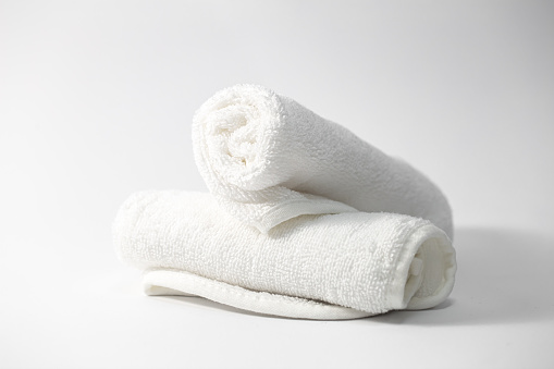 White face towels on a white background isolated, close-up.