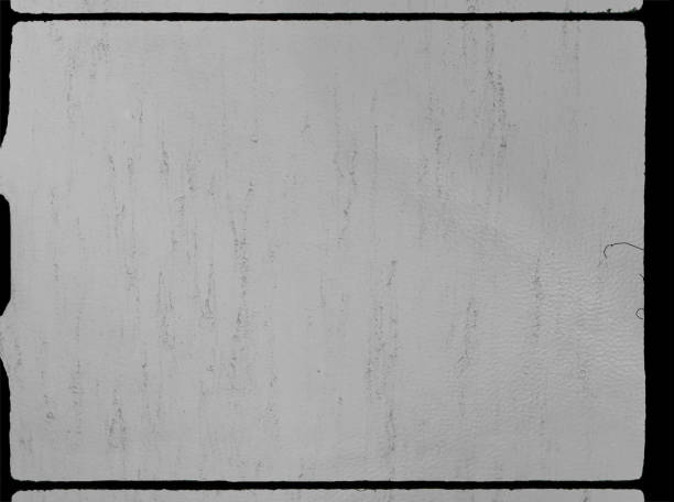 empty or blank super 8mm film frame with black border and dust. film texture.