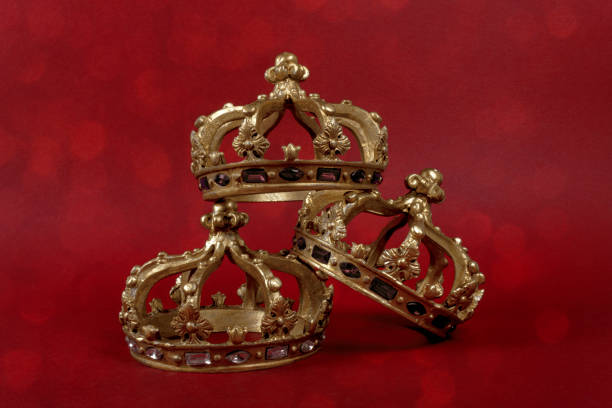 istock Happy Three King's Day. Three gold crowns on red background. Concept for Reyes Magos, Three Wise Men or Happy Epiphany day. 1453851851