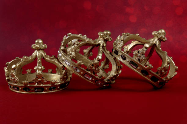 istock Happy Three King's Day. Three gold crowns on red background. Concept for Reyes Magos, Three Wise Men or Happy Epiphany day. 1453851854
