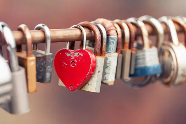 Photo of Love locks on bridge. Padlock as symbol of love and affection