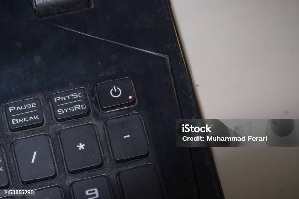 Close Up Of A Laptop With A Lock And Shutdown Button Stock Photo - Download Image Now