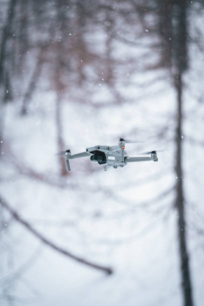 istock DJI drone flying on the snowy forest 1453857169