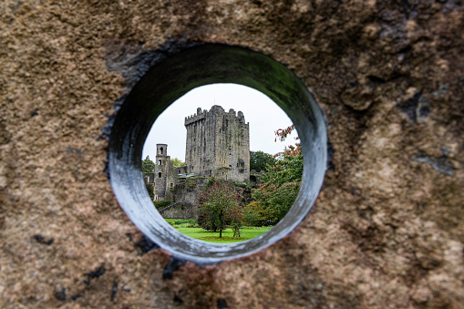Blarney Castle was built by the MacCarthy of Muskerry dynasty and dates from 1446. Situated 8km from Cork City, this historic castle is most famous for its stone, which has the traditional power of conferring eloquence on all who kiss it. The stone is set in the wall below the battlements, and to kiss it one has to lean backwards (grasping an iron railing) from the parapet walk.