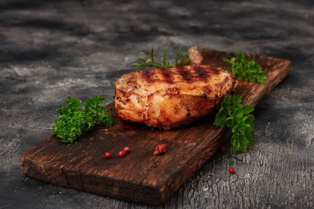 istock Grilled pork meat with bone on wooden board 1453857466