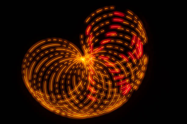 istock Abstract: Colorful Swirls of Light Creating Butterfly Pattern on a Black Background 1453858137
